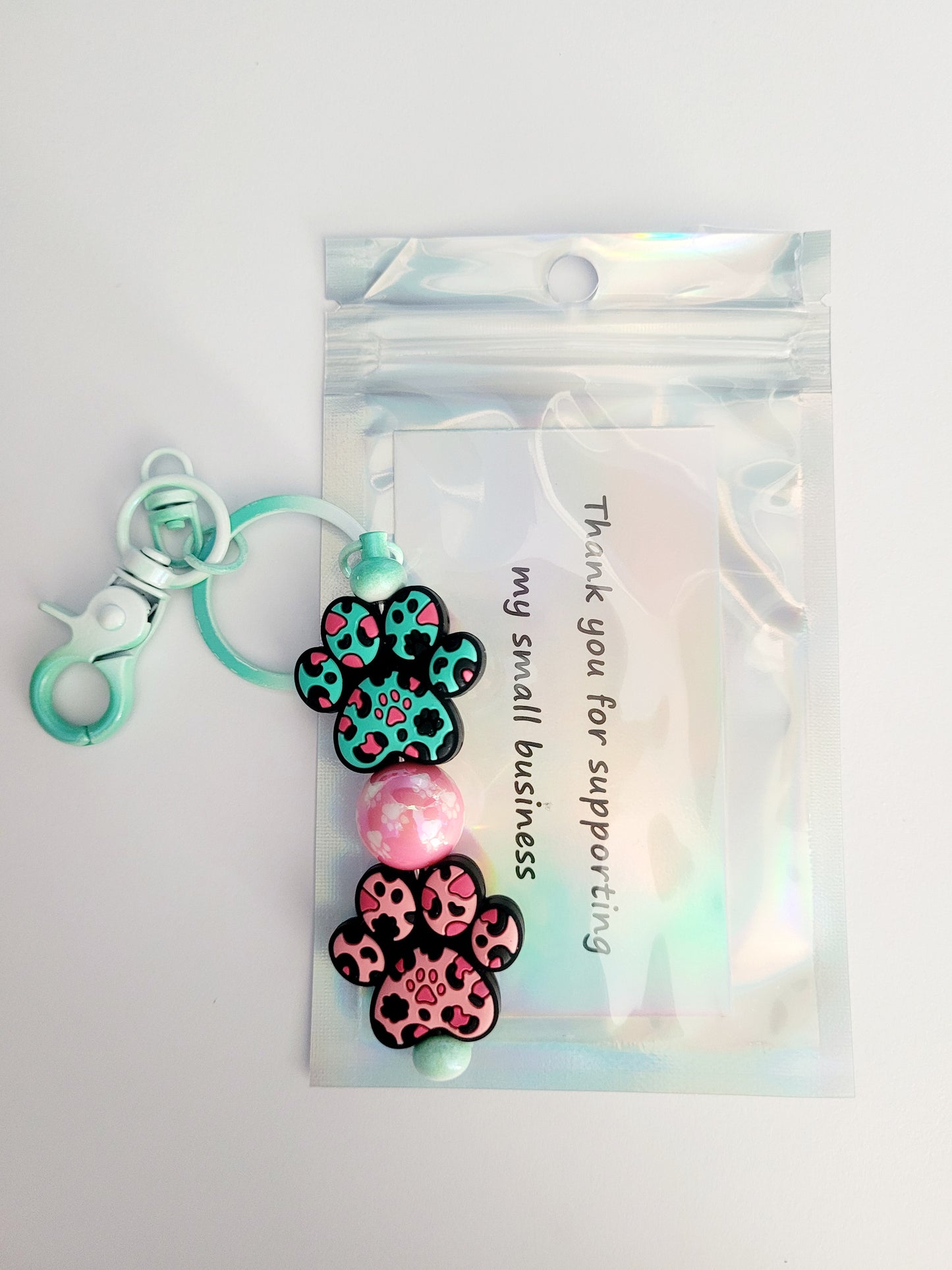 'Less People, More Dogs' Beaded Green Metal Keyring