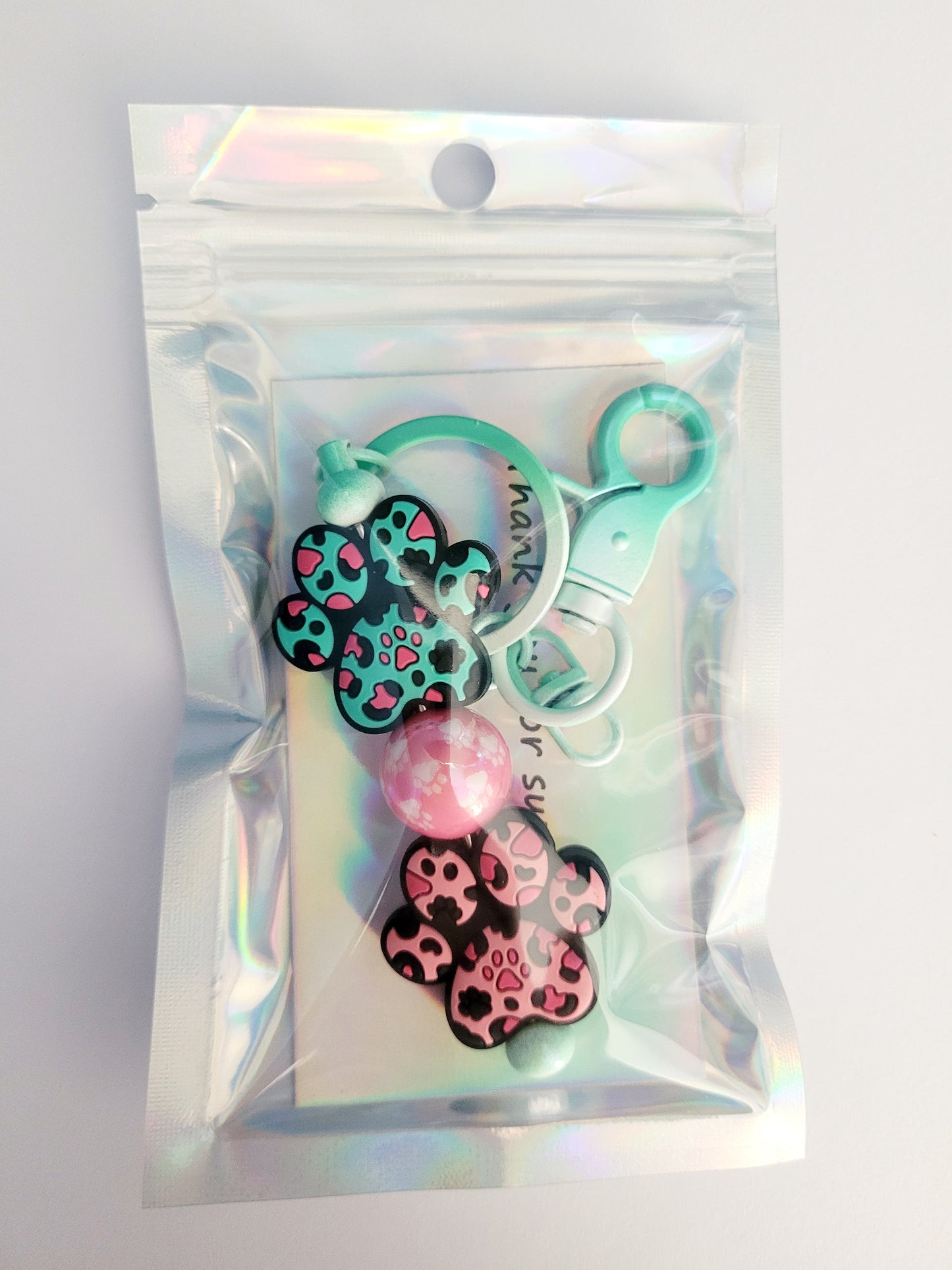 'Less People, More Dogs' Beaded Green Metal Keyring